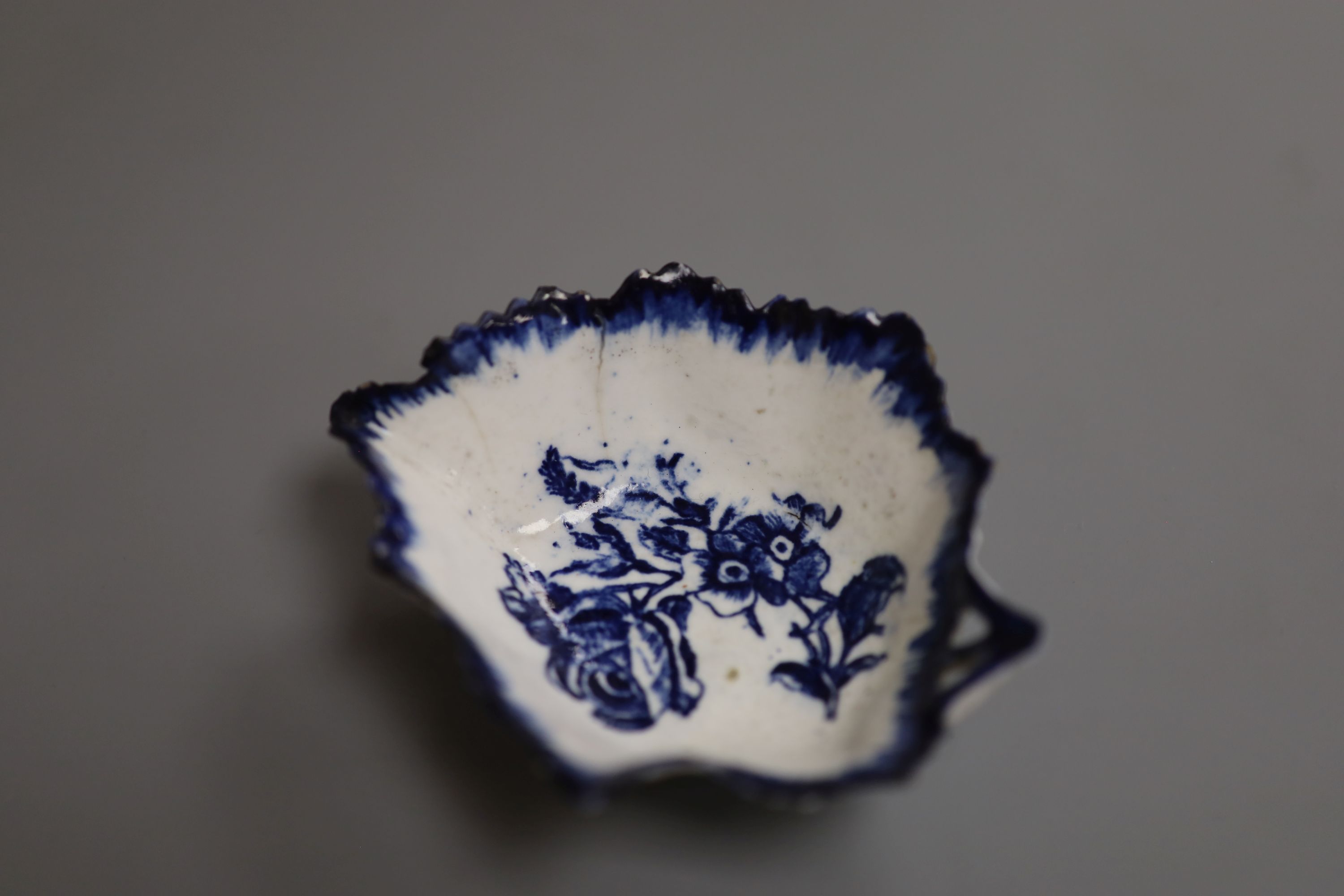 A Derby leaf shaped pickle dish printed with roses, under a painted border ex. Gilbert Bradley Col., green GB mark, length 9.5cm